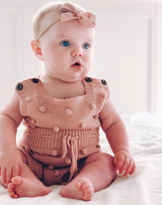 ROMPER TEJIDO ROSA CON BOLITAS